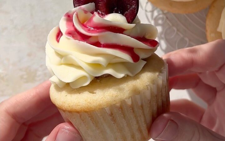 Vanilla Cupcakes with Cherry Jam and White Chocolate Buttercream