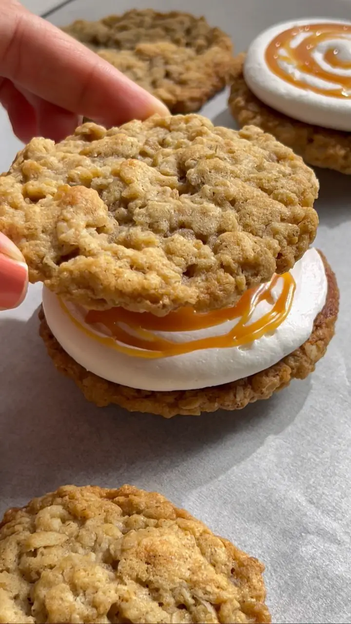 Cream Cheese Frosted Oatmeal Cookie Sandwich with Caramel Drizzle